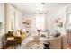 Inviting living room featuring natural light, elegant furnishings, and a sophisticated geometric light fixture at 629 Hansell Se St, Atlanta, GA 30312