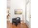 Stylish armchair sitting area with ample natural light and tasteful decor at 629 Hansell Se St, Atlanta, GA 30312