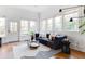 Bright living room with neutral decor, hardwood floors, and large windows at 629 Hansell Se St, Atlanta, GA 30312