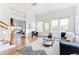 Bright living room with hardwood floors and large windows at 629 Hansell Se St, Atlanta, GA 30312