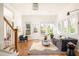 Bright living room featuring hardwood floors, large windows, and a modern sofa at 629 Hansell Se St, Atlanta, GA 30312