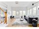 Bright living room with neutral decor, hardwood floors and views from large windows at 629 Hansell Se St, Atlanta, GA 30312