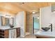 Spacious bathroom featuring wood ceilings and modern vanities at 703 Somerset Dr, Lawrenceville, GA 30046