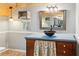 Bathroom featuring wood ceilings, vessel sinks and modern vanities at 703 Somerset Dr, Lawrenceville, GA 30046