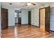 Spacious bedroom with ceiling fan, light-blue walls and wood-look flooring at 703 Somerset Dr, Lawrenceville, GA 30046