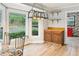 An eat-in kitchen and large windows provide views of the lush greenery outside at 703 Somerset Dr, Lawrenceville, GA 30046