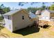 Backyard view showcasing a well-maintained yard, a deck and home's exterior at 195 W Fork Way, Temple, GA 30179