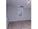 Bright finished basement with window showing outdoor view and durable modern flooring at 195 W Fork Way, Temple, GA 30179