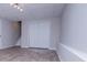 This basement features luxury vinyl plank flooring, a staircase, and overhead lighting at 195 W Fork Way, Temple, GA 30179