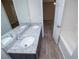 Bathroom featuring double sinks with stone countertop and a tub/shower at 195 W Fork Way, Temple, GA 30179