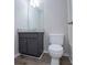 This bathroom features a gray vanity with a granite top, toilet, and luxury vinyl plank flooring at 195 W Fork Way, Temple, GA 30179