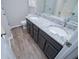 Bathroom features a double sink vanity with granite countertop and modern fixtures at 195 W Fork Way, Temple, GA 30179