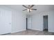 This bedroom features a ceiling fan, a window, and luxury vinyl plank flooring at 195 W Fork Way, Temple, GA 30179
