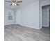 This bedroom features a ceiling fan, a window, and luxury vinyl plank flooring at 195 W Fork Way, Temple, GA 30179