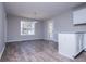 Bright dining area featuring wood-look floors, large window, and convenient access to the backyard at 195 W Fork Way, Temple, GA 30179