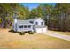 Charming two-story home featuring a covered porch, two-car garage, and beautifully landscaped front yard at 195 W Fork Way, Temple, GA 30179