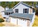 Stately two-story home boasts a two-car garage and lovely front porch, perfect for relaxing outdoors at 195 W Fork Way, Temple, GA 30179