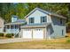 Charming two-story home with stone accents, attached two-car garage, and a cozy front porch at 195 W Fork Way, Temple, GA 30179