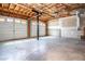 Spacious two car garage featuring unfinished walls and ceilings at 195 W Fork Way, Temple, GA 30179