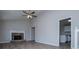 Spacious living room featuring a stone fireplace with white mantel at 195 W Fork Way, Temple, GA 30179