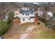 Aerial view of the home showing the backyard deck and surrounding mature trees at 2370 Mcafee Rd, Decatur, GA 30032