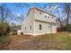 A two-story home featuring vinyl siding and a backyard on a lot with mature trees at 2370 Mcafee Rd, Decatur, GA 30032