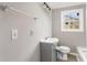 Bathroom with neutral walls, pedestal sink, and natural light from the window at 2370 Mcafee Rd, Decatur, GA 30032