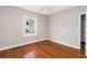 Bedroom with hardwood floors, neutral walls, and natural light from the window at 2370 Mcafee Rd, Decatur, GA 30032