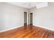 Bedroom with hardwood floors, neutral walls, and walk-in closet at 2370 Mcafee Rd, Decatur, GA 30032