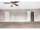This bedroom features neutral-colored walls, a ceiling fan, and a large closet at 2370 Mcafee Rd, Decatur, GA 30032