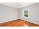 Bedroom with hardwood floors, neutral walls, ceiling fan and natural light from the window at 2370 Mcafee Rd, Decatur, GA 30032