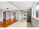 Open dining area with a pendant light fixture and views to the kitchen and another living space at 2370 Mcafee Rd, Decatur, GA 30032