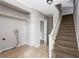 Tiled entryway with coat closet space and carpeted stairs to the upper level at 2370 Mcafee Rd, Decatur, GA 30032