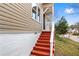 A close up of the front entrance featuring red stairs and a covered porch at 2370 Mcafee Rd, Decatur, GA 30032