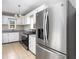 Well-lit kitchen featuring stainless steel appliances, granite countertops, and ample cabinet space at 2370 Mcafee Rd, Decatur, GA 30032