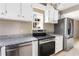 Kitchen featuring stainless steel appliances, granite countertops, and ample cabinet space at 2370 Mcafee Rd, Decatur, GA 30032