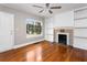 The living room has hardwood floors, a fireplace and built-in shelving at 2370 Mcafee Rd, Decatur, GA 30032