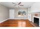 The living room has hardwood floors, a fireplace and built-in shelving and a doorway to the exterior at 2370 Mcafee Rd, Decatur, GA 30032