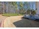 Expansive backyard features lush landscaping, mature trees, and a tranquil setting at 4780 Woodruff Trce, Cumming, GA 30028