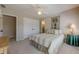 Comfortable bedroom featuring a ceiling fan, neutral decor, and access to an ensuite bathroom at 4780 Woodruff Trce, Cumming, GA 30028