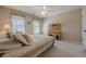 Bright bedroom with plush carpet and two sunny windows creates an inviting and cozy retreat at 4780 Woodruff Trce, Cumming, GA 30028