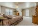 Spacious bedroom with ample natural light, ceiling fan, and neutral-toned walls at 4780 Woodruff Trce, Cumming, GA 30028