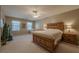 Primary bedroom retreat featuring a ceiling fan, and an adjacent sitting area at 4780 Woodruff Trce, Cumming, GA 30028
