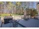 Picturesque deck area with outdoor seating and grilling station overlooking the backyard at 4780 Woodruff Trce, Cumming, GA 30028