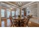 Open floor plan featuring an eat-in dining area, hardwood floors, and lots of natural light at 4780 Woodruff Trce, Cumming, GA 30028