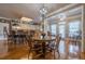 Open floor plan with eat-in kitchen, dining room, and hardwood floors throughout at 4780 Woodruff Trce, Cumming, GA 30028