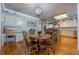 Open floor plan with eat-in kitchen, dining room, and hardwood floors at 4780 Woodruff Trce, Cumming, GA 30028