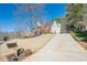 Beautiful two-story brick home with well-kept lawn and a long driveway leading to the main entrance at 4780 Woodruff Trce, Cumming, GA 30028