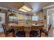 Eat-in kitchen featuring granite countertops, stainless steel refrigerator, and custom cabinetry at 4780 Woodruff Trce, Cumming, GA 30028