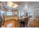 Open kitchen with granite countertops, stainless steel appliances, and views to living room and dining nook at 4780 Woodruff Trce, Cumming, GA 30028